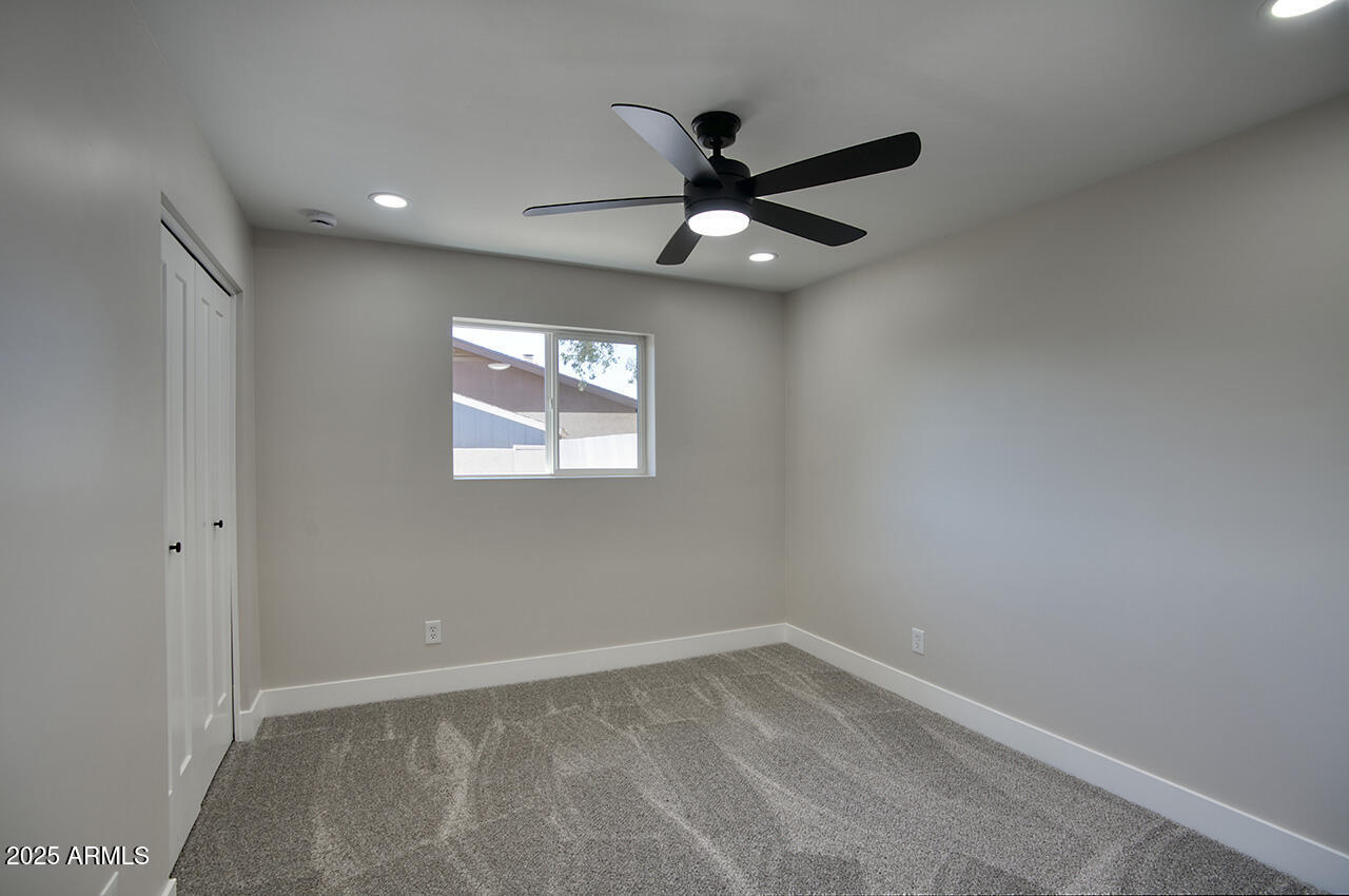 1561 North 26th Street Mesa, AZ 85213 - Photo 27 of 35 an empty room with a window