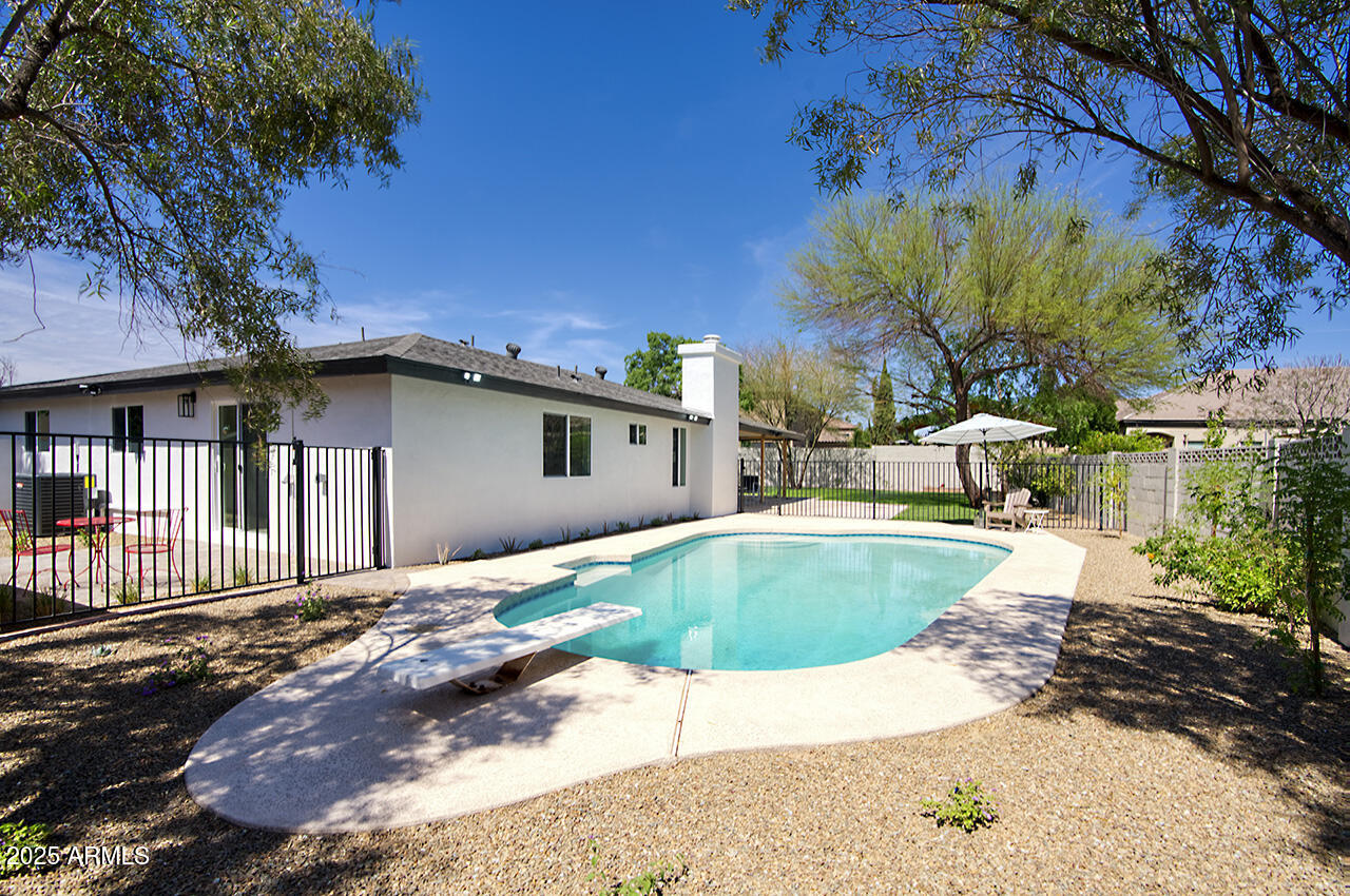 1561 North 26th Street Mesa, AZ 85213 - Photo 30 of 35 a view of a house with backyard and sitting area
