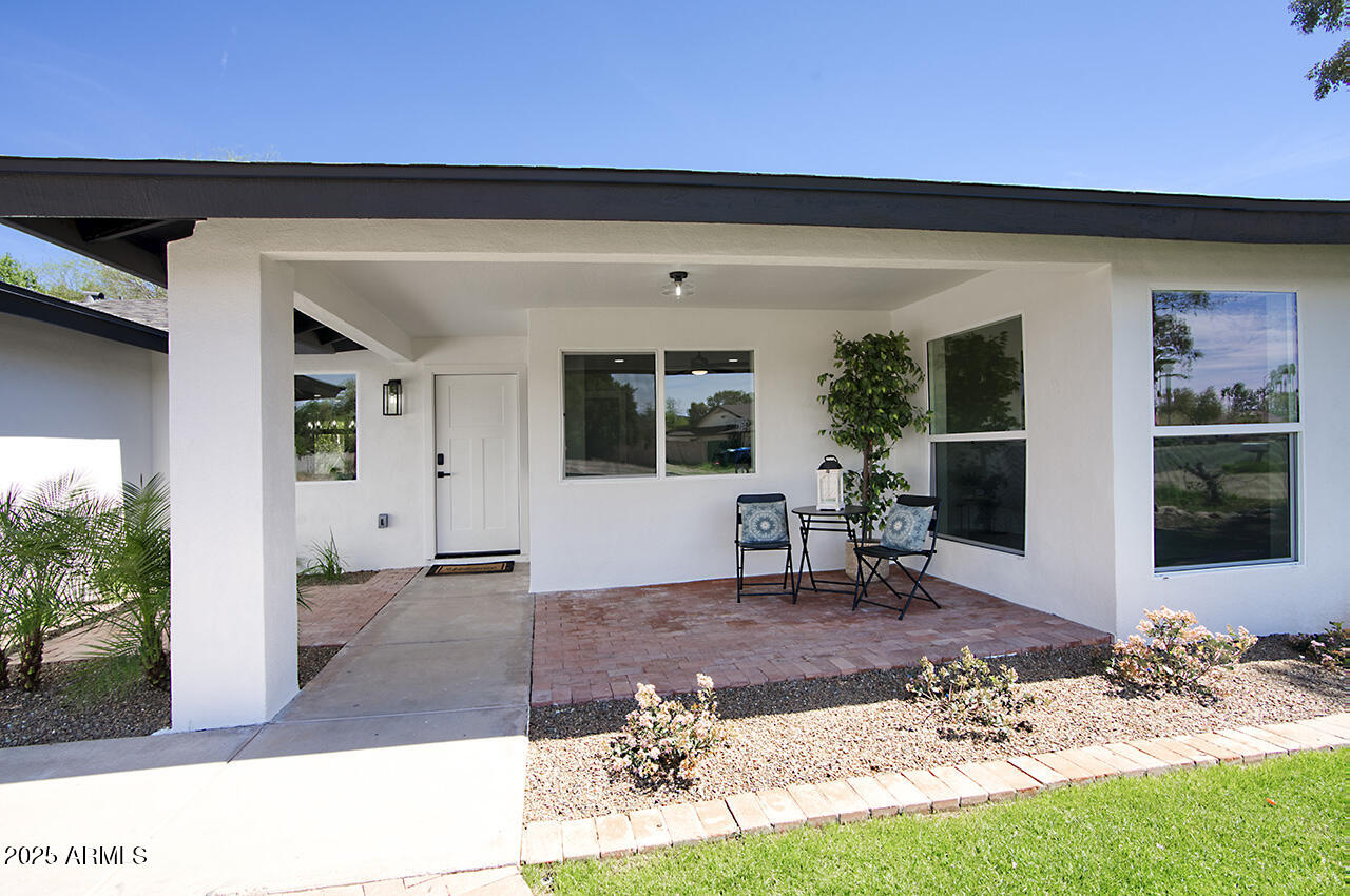 1561 North 26th Street Mesa, AZ 85213 - Photo 3 of 35 a view of a porch with chairs and backyard