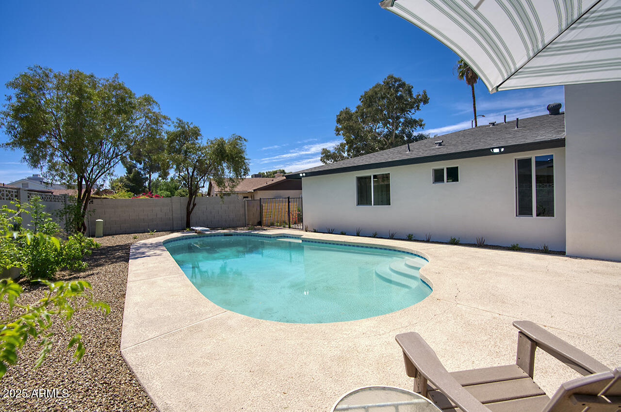 1561 North 26th Street Mesa, AZ 85213 - Photo 32 of 35 a view of outdoor space yard and swimming pool