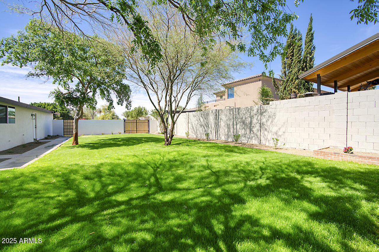 1561 North 26th Street Mesa, AZ 85213 - Photo 33 of 35 a view of a house with a yard