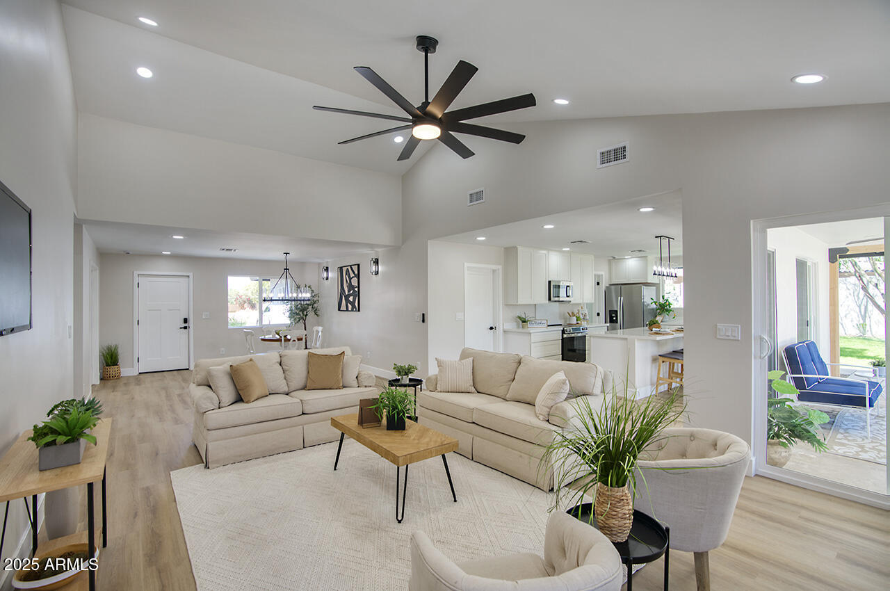 1561 North 26th Street Mesa, AZ 85213 - Photo 9 of 35 a living room with furniture and a large window