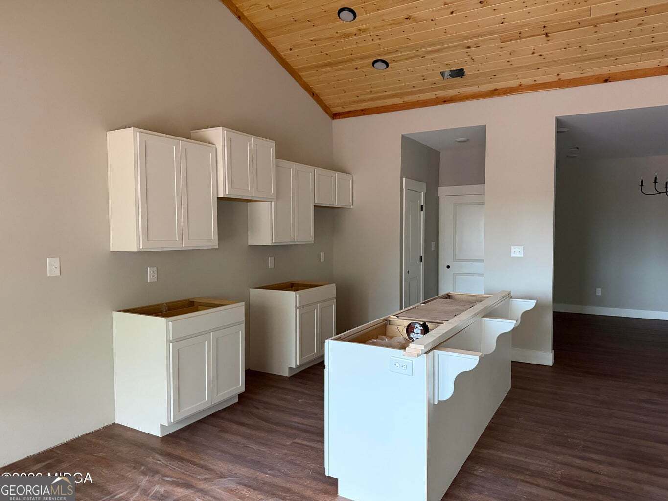 146 Overland Way Gray, GA 31032 - Photo 7 of 8 a living room with kitchen island furniture and wooden floor