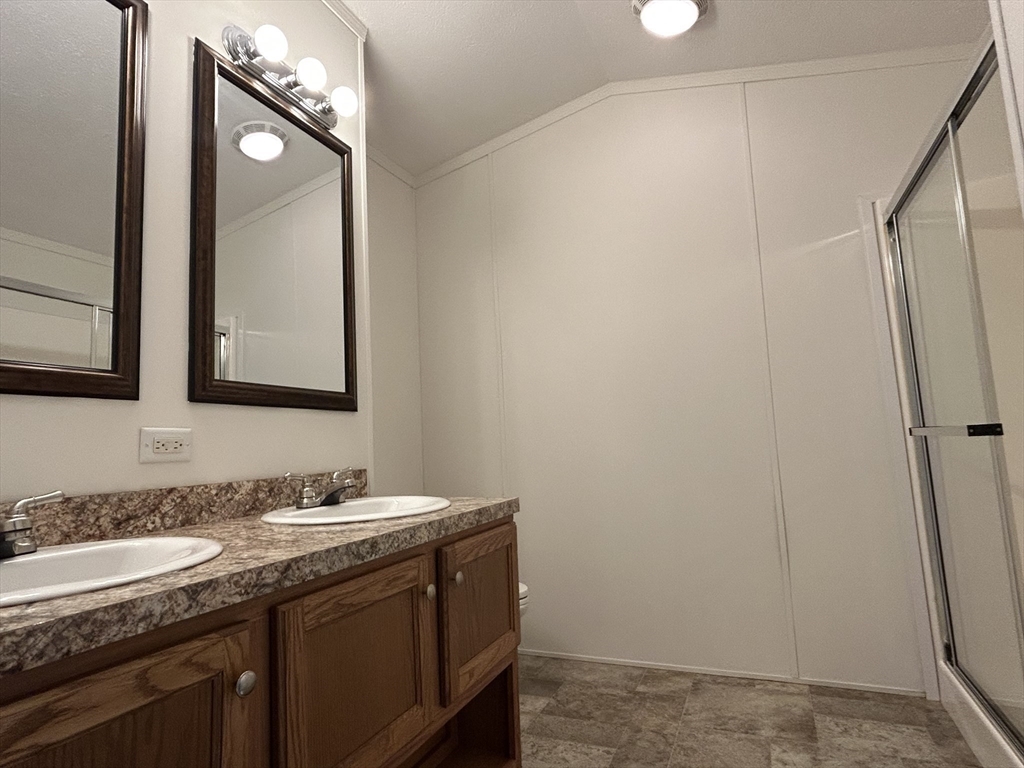 8 Alfred Street Wareham, MA 02538 - Photo 5 of 8 a bathroom with a sink and a mirror