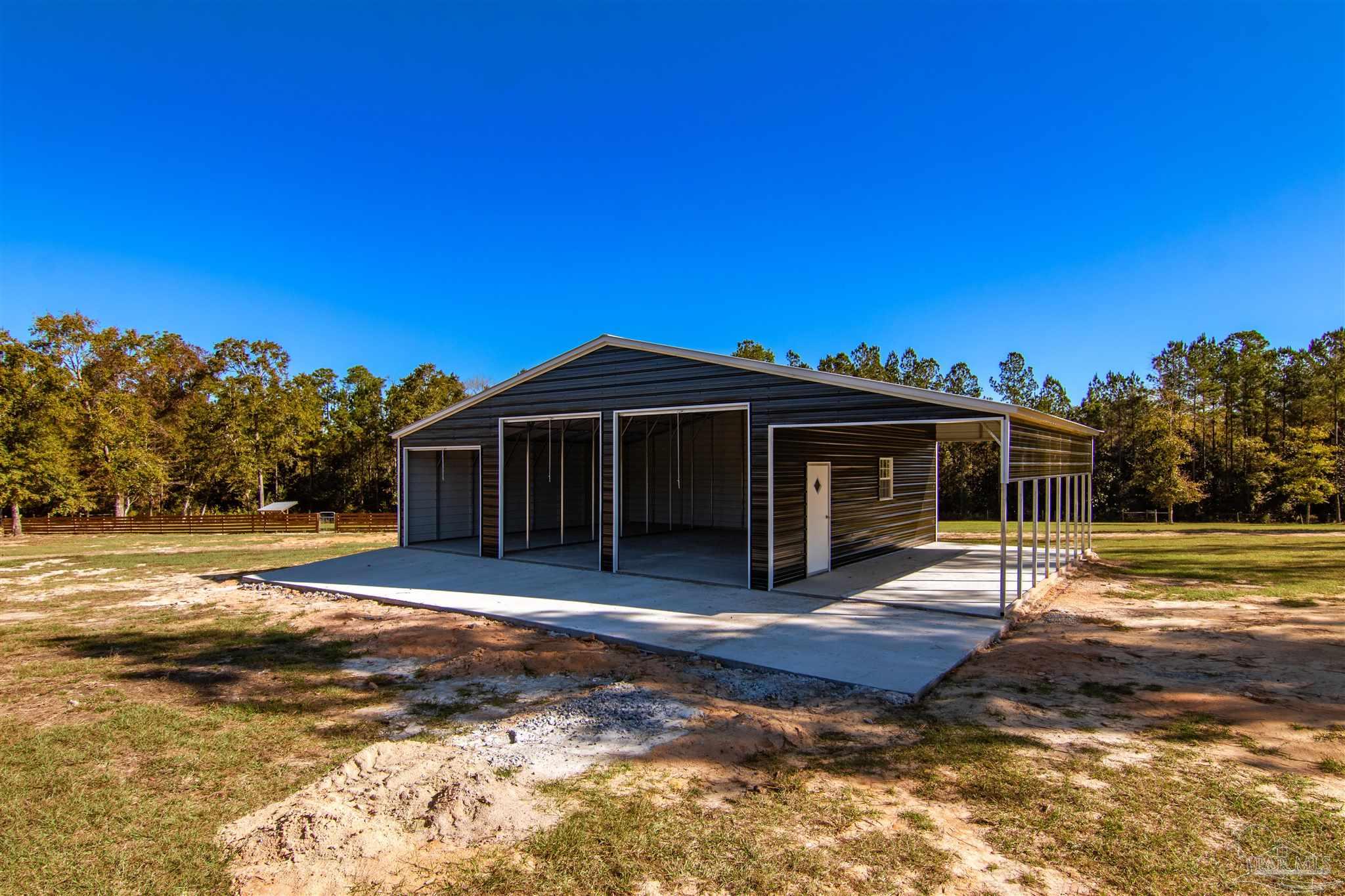 2232 Bison Drive Pace, FL 32571 - Photo 12 of 27 a view of a house with a yard