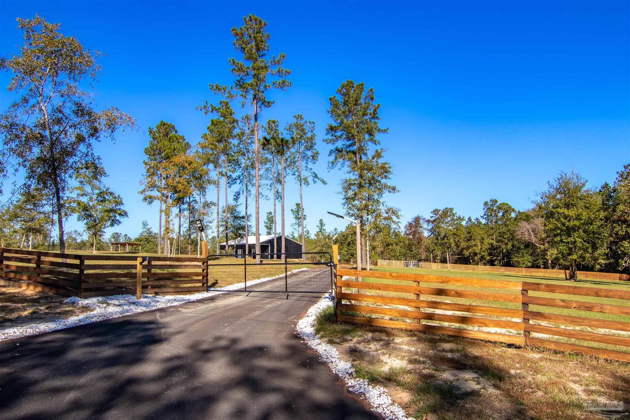 2232 Bison Drive Pace, FL 32571 - Photo 2 of 27 a view of a yard with a slide