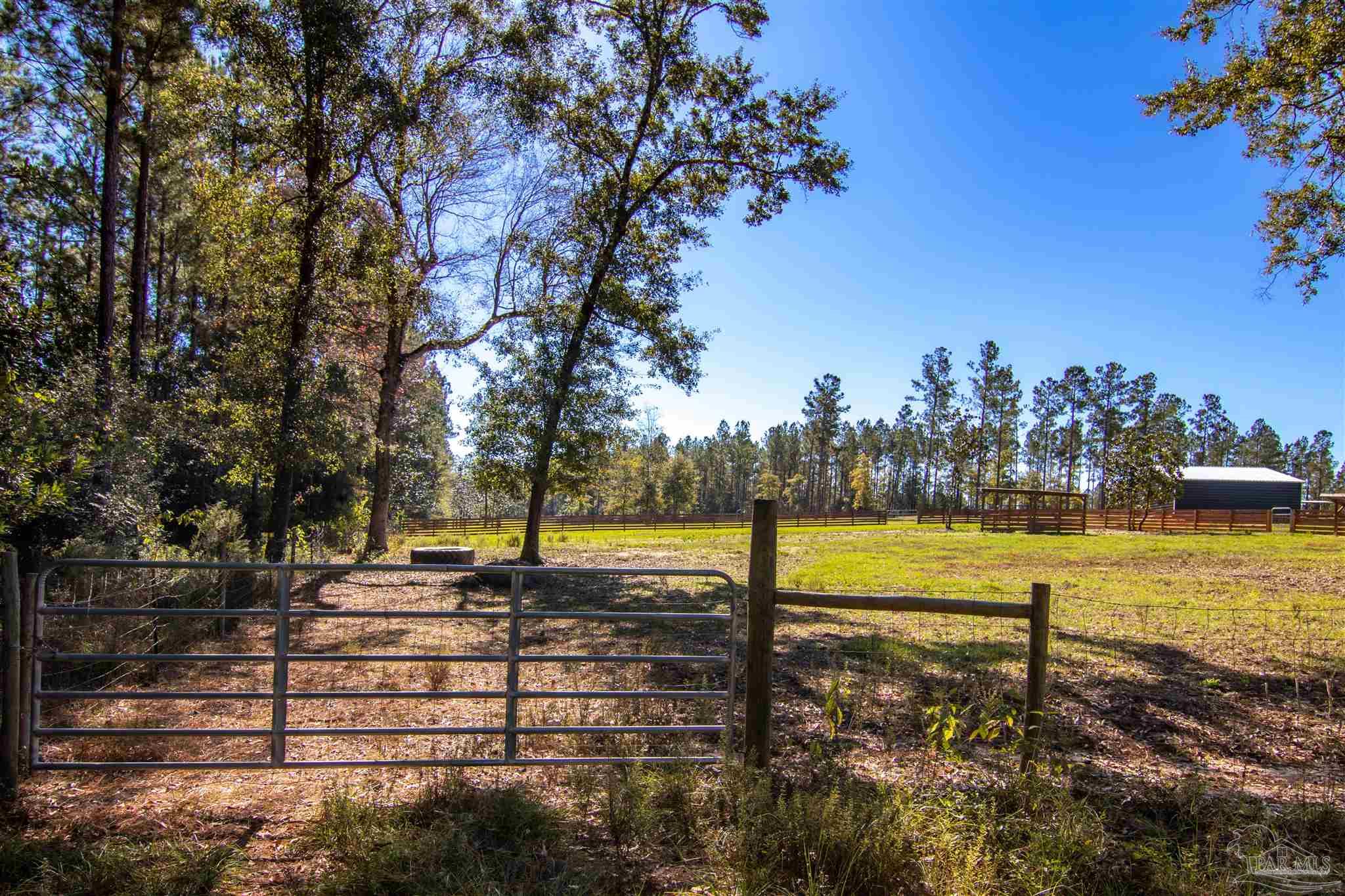 2232 Bison Drive Pace, FL 32571 - Photo 21 of 27 a view of a lake with houses