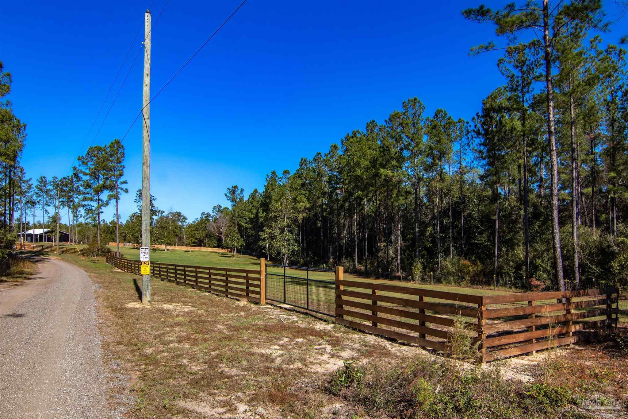 2232 Bison Drive Pace, FL 32571 - Photo 25 of 27 a view of outdoor space with deck and living area