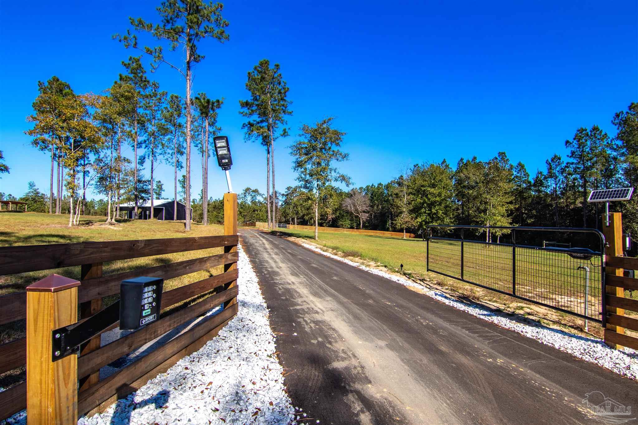 2232 Bison Drive Pace, FL 32571 - Photo 3 of 27 a view of a yard with wooden fence