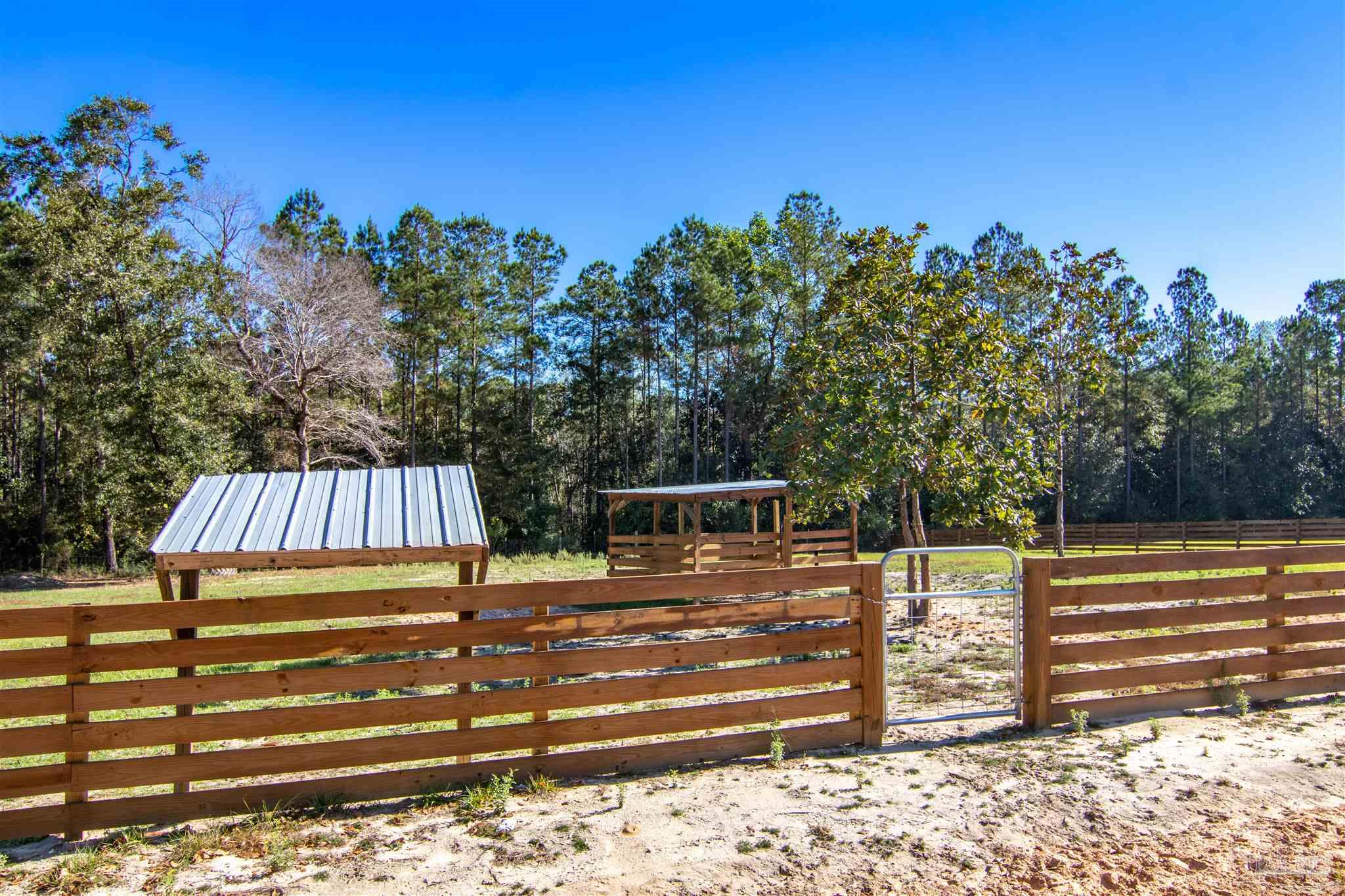 2232 Bison Drive Pace, FL 32571 - Photo 9 of 27 a view of a balcony with outdoor space