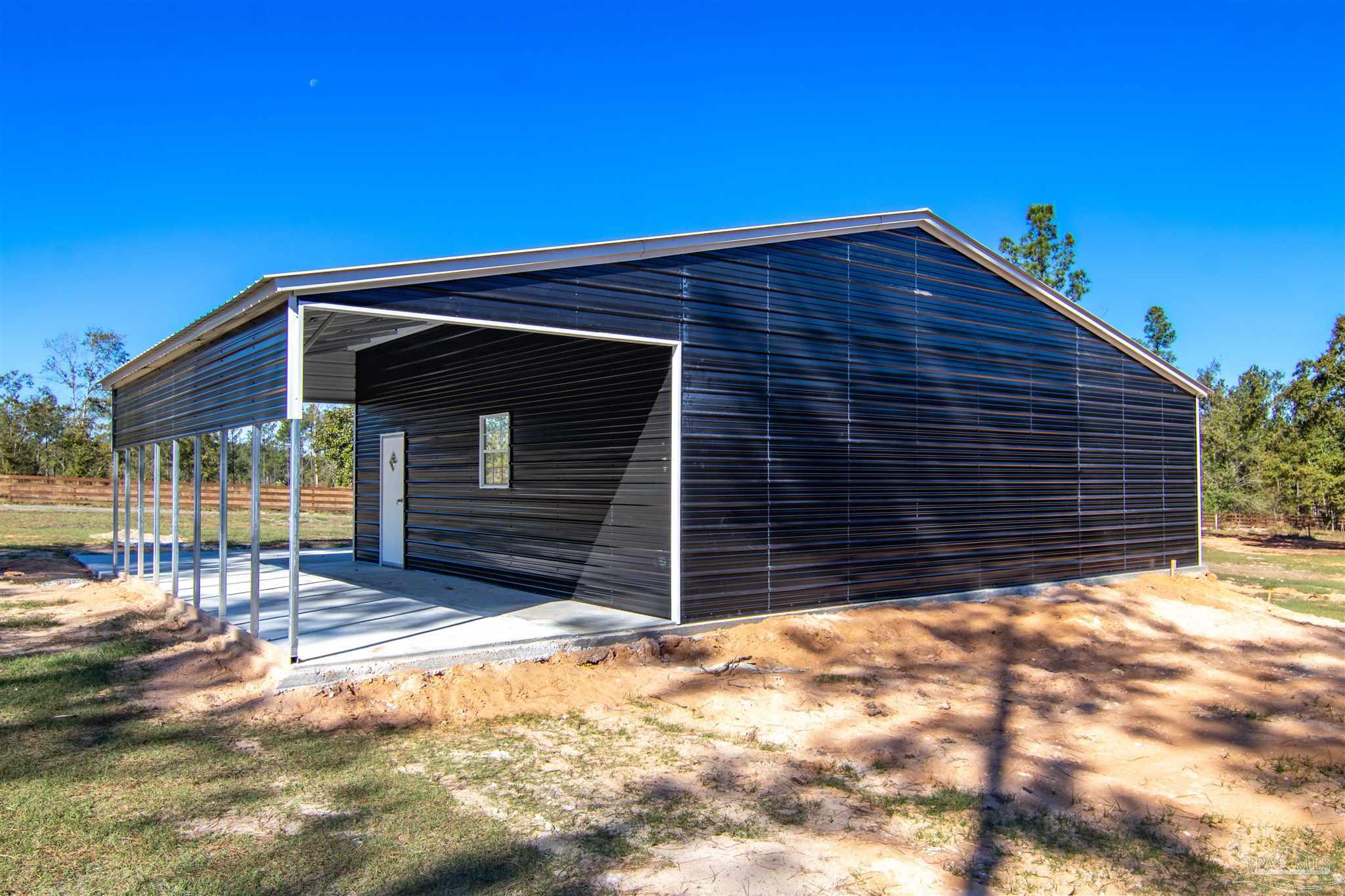 2232 Bison Drive Pace, FL 32571 - Photo 10 of 27 a front view of a house with a yard