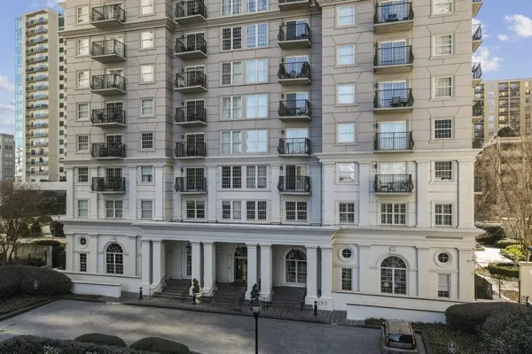 a view of a building with a yard