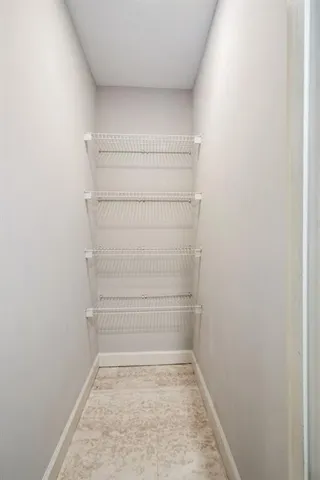 a kitchen with cabinets and stainless steel appliances