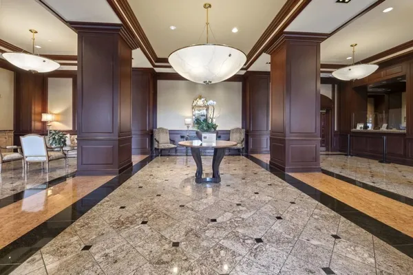 a media room with lots of chairs and a projector screen