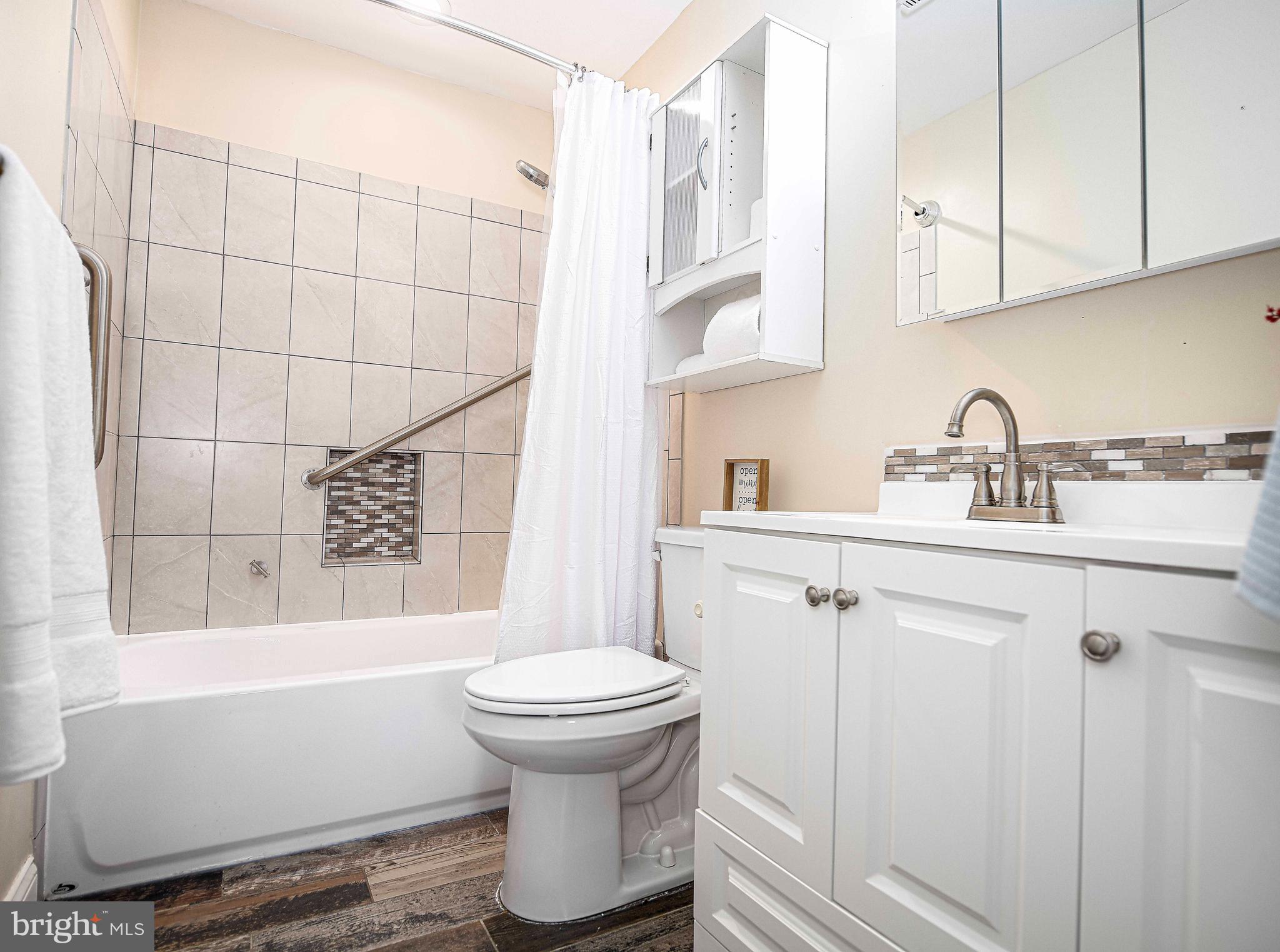 807 Ferguson Road Joppa, MD 21085 - Photo 25 of 44 Hall full bath w/ white cabinetry