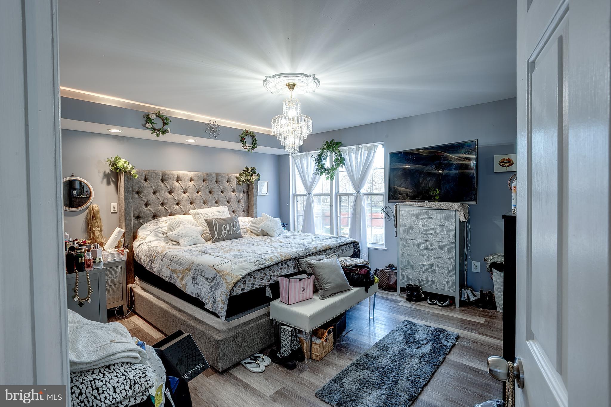 65 Morris Drive Sicklerville, NJ 08081 - Photo 11 of 28 a spacious bedroom with a bed and a television