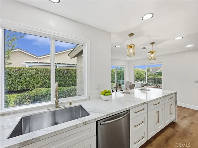 a kitchen with sink and window