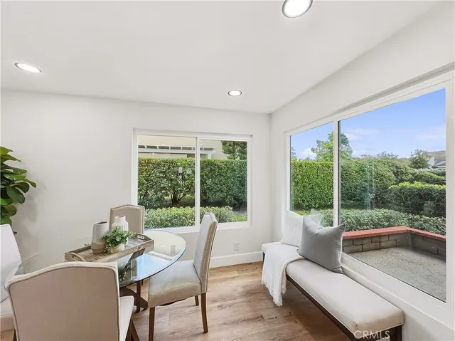 a large kitchen with a table and chairs