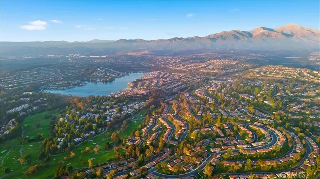 an aerial view of a houses with ocean view