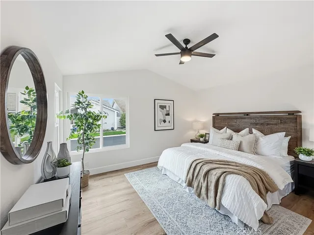 a bedroom with a large bed and a window