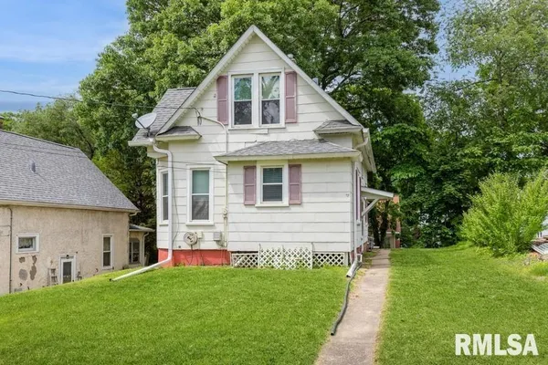 a front view of house with yard