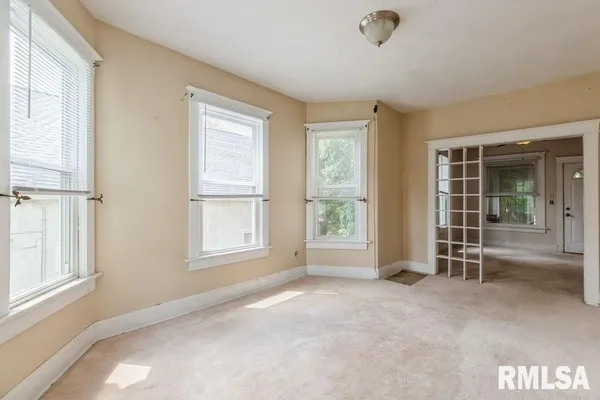 an empty room with windows