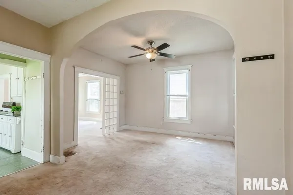 an empty room that has a window in it