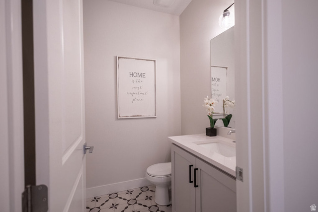 209 North 1140 West Mapleton, UT 84664 - Photo 7 of 21 Half bathroom featuring vanity and toilet