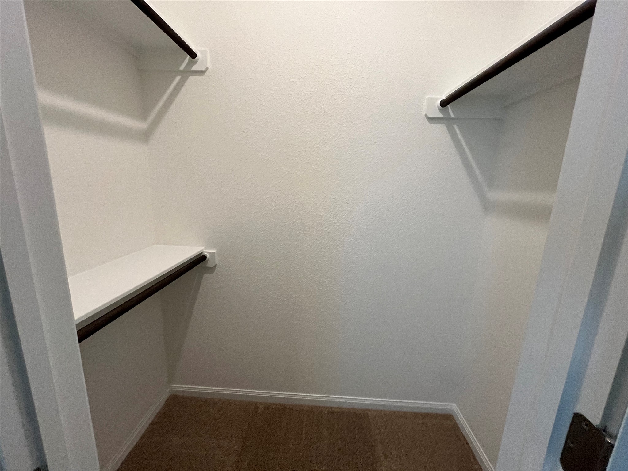 8518 Wellspring Loop Round Rock, TX 78665 - Photo 23 of 32 Upstairs walk in closet Bedroom 2