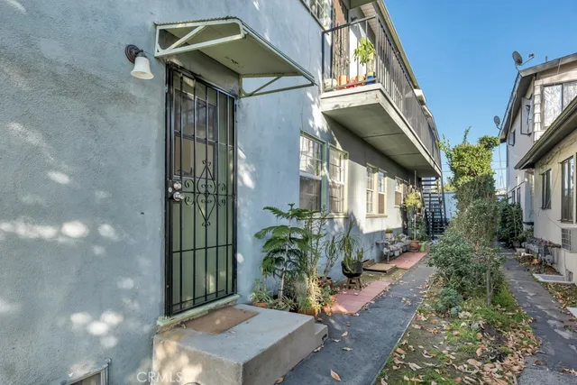 a backyard of a house with outdoor seating