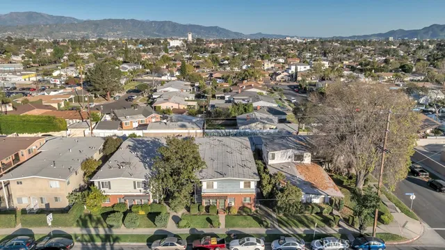 a aerial view of a house with a yard