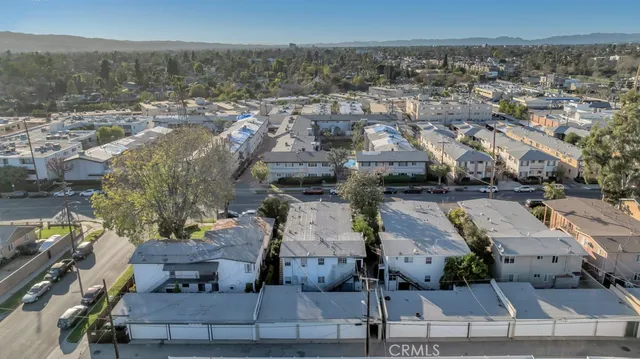 an aerial view of a house with a yard