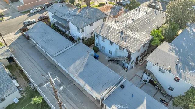 a view of a backyard with wooden fence