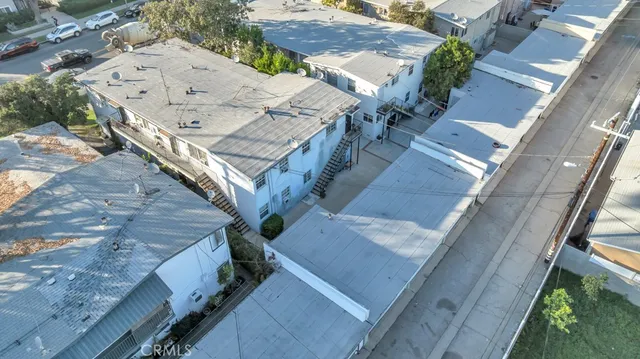 an aerial view of a house with a yard