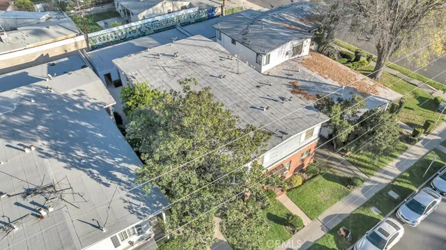 a view of a patio with table and chairs with wooden floor and plants
