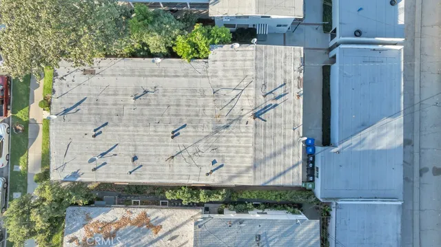 an aerial view of residential house with outdoor space and trees