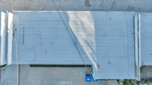a roof deck with table and chairs