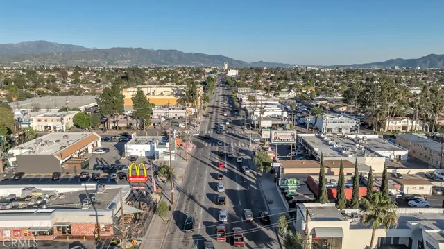 a front view of a house with outdoor seating