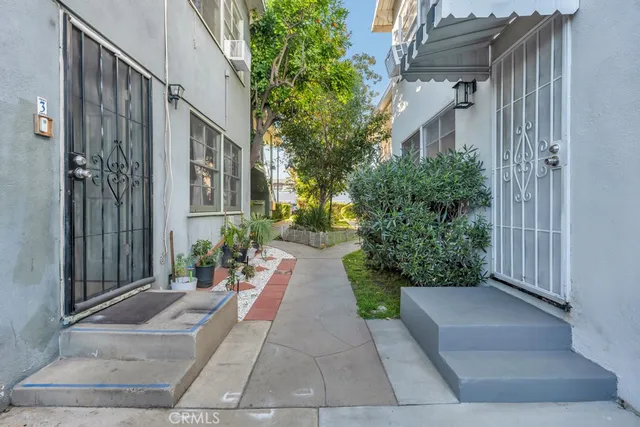 a view of a pathway both side of house