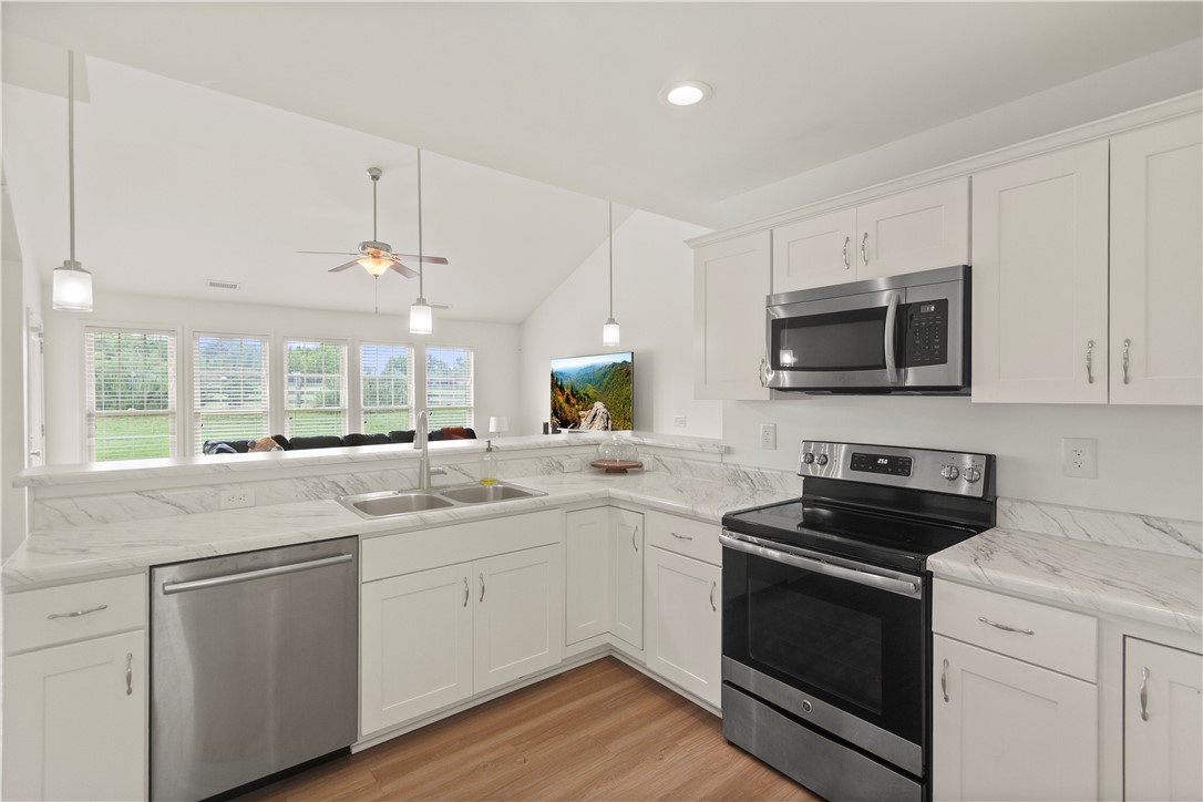 2900 Highway 187 Anderson, SC 29626 - Photo 15 of 41 A well-lit kitchen with sleek stainless steel appliances and abundant counter space.
