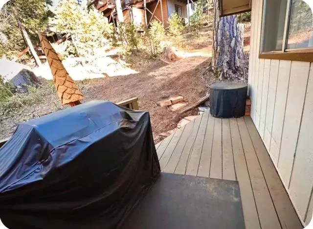 a aerial view of a house with a yard and tree s