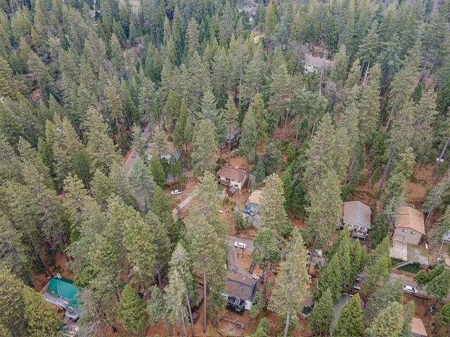 a picture of a bench in front of a white house