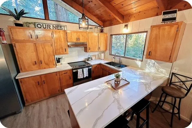 a view of a dining table and chairs in the kitchen