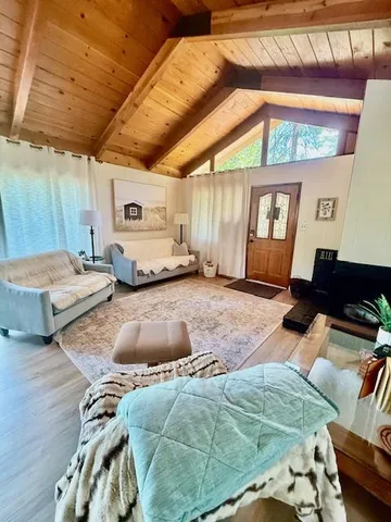 a bedroom with bed and a large window