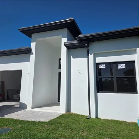 a view of front door and yard