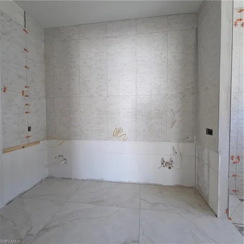 a bathroom with a sink and a shower