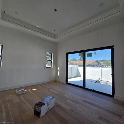 a view of a hallway with wooden walls