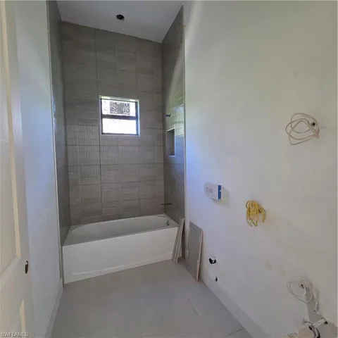 a view of a closet area with an empty room