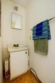 a living room with a couch and a stove