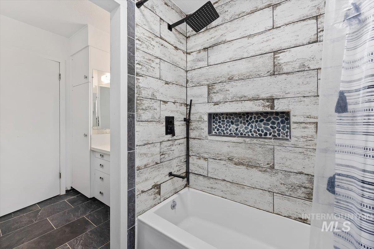 1214 H Street Rupert, ID 83350 - Photo 24 of 35 Bathroom featuring shower / bathtub combination with curtain and vanity